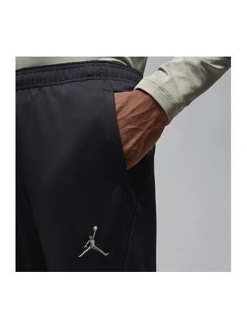 NIKE Slim fit Weatherproof pants in Black