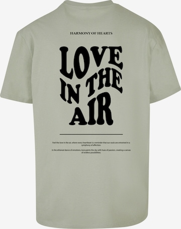 Merchcode T-Shirt 'Love In The Air' in Grün