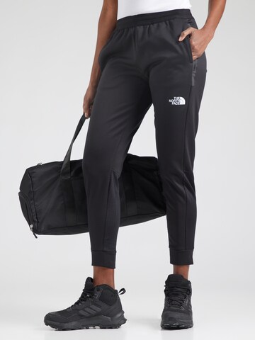 THE NORTH FACE - Tapered Pantalón deportivo 'Mountain Athletics' en negro: frente