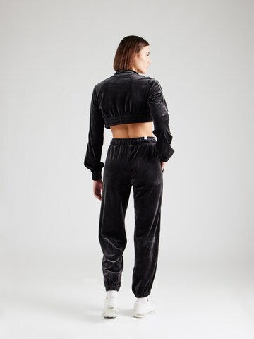 Nike Sportswear Tapered Housut värissä musta