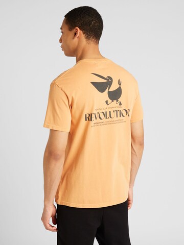 T-Shirt Revolution en orange : devant