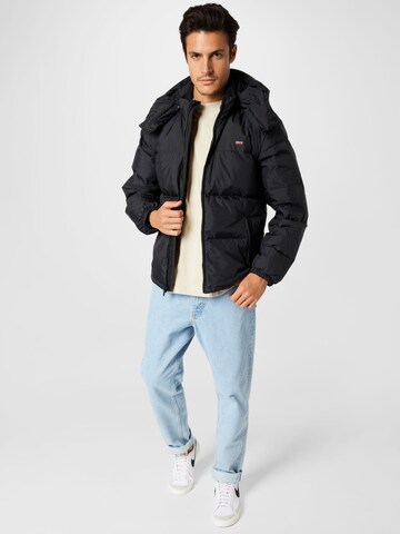 LEVI'S ® Talvitakki 'Hooded Fillmore Short Jacket' värissä musta