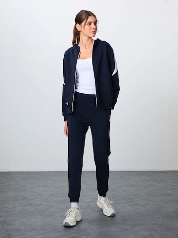 Tommy Life Trenirka za tek | modra barva: sprednja stran
