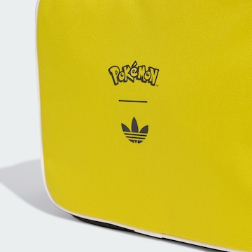 ADIDAS ORIGINALS - Recipiente de almacenamiento 'Pokemon' en amarillo