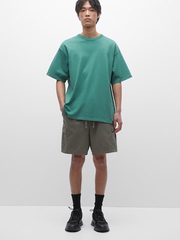 Pull&Bear Ohlapna forma Kargo hlače | zelena barva