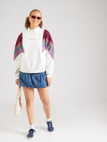 Kaotiko Collegepaita 'CREW GINGER' värissä beige