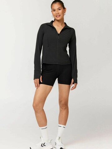 Girlfriend Collective Urheilutakki ' Estrella ' värissä musta