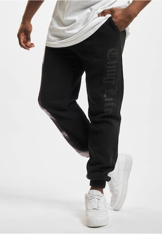 Thug Life Tapered Pants in Black: front