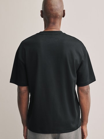 Tricou de la Next pe negru
