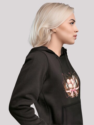 Sweat-shirt 'Osterei Nest Korb Dekor' F4NT4STIC en noir