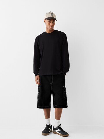 Bershka Loosefit Shorts in Schwarz