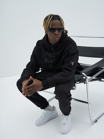 Koyumi - Sudadera 'Oversize Hoodie mit Zipper & Print – 3-Faden Stoff - Warm 'Yasin Says'' en negro