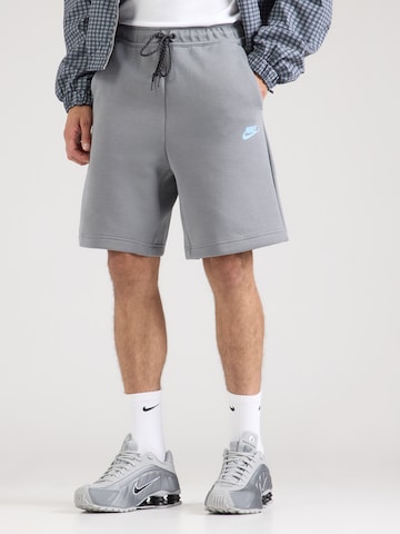 Nike Sportswear Lużny krój Spodnie 'TECH FLC' w kolorze szary: przód