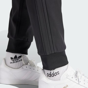 ADIDAS ORIGINALS Tapered Nadrág 'SST Bonded' - fekete