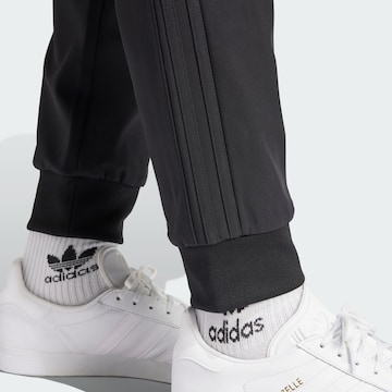 ADIDAS ORIGINALS Zúžený strih Nohavice 'SST Bonded' - Čierna