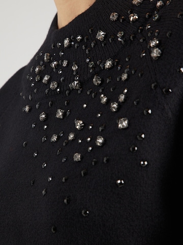 monari Kampsun, värv must