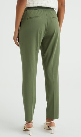 Slimfit Pantaloni con piega frontale di WE Fashion in verde
