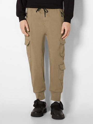 Bershka Tapered Lærredsbukser i beige: forside