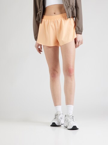 Athlecia Loose fit Sports trousers 'Arilay' in Orange: front