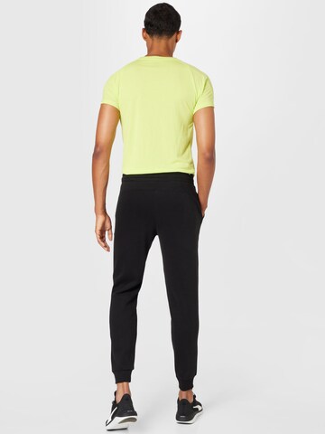 PUMA Tapered Sportbroek in Zwart