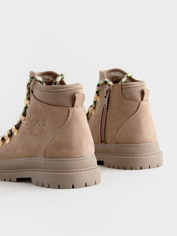 Bottes Next en beige
