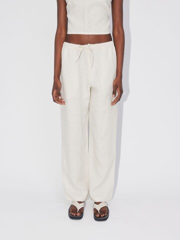 ABOUT YOU REBIRTH STUDIOS Wide leg Pants 'Holiday' in Beige