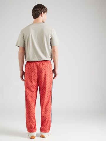 PUMA Loosefit Παντελόνι φόρμας 'Road To Unity' σε κόκκινο