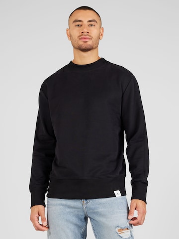 Bluză de molton de la Calvin Klein Jeans pe negru: față