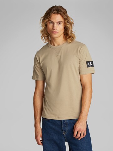 Calvin Klein Jeans Koszulka w kolorze beżowy: przód
