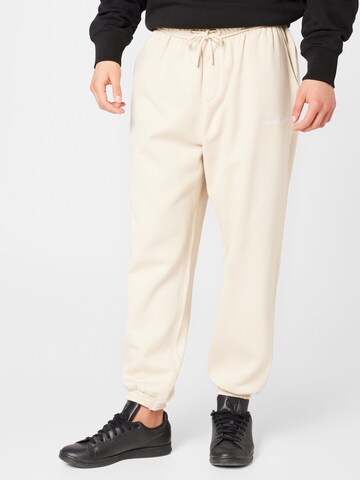 Calvin Klein Jeans Tapered Trousers 'INSTITUTIONAL' in Beige: front