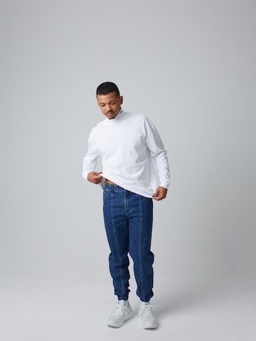 ABOUT YOU x Benny Cristo Tapered Jeans 'Simon' i blå