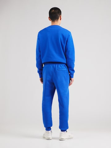 Nike SportswearTapered Hlače 'CLUB' - plava boja