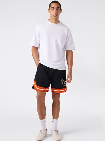 Largi Pantaloni de la Champion pe negru: față