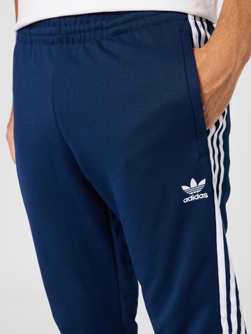 ADIDAS ORIGINALS Tapered Trousers 'Adicolor Classics Primeblue Sst' in Blue