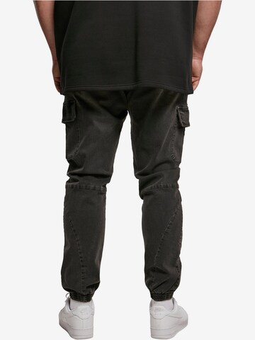 Tapered Jeans cargo di Urban Classics in nero