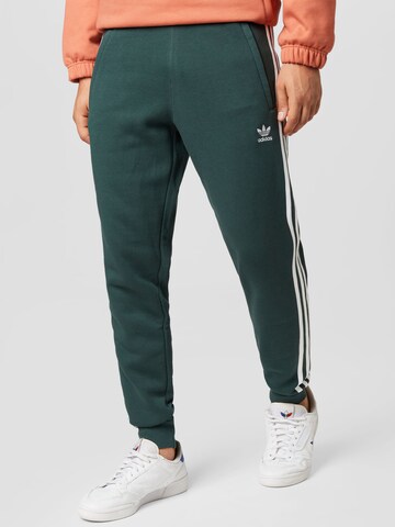 ADIDAS ORIGINALS Конический (Tapered) Штаны 'Adicolor' в Зеленый: спереди