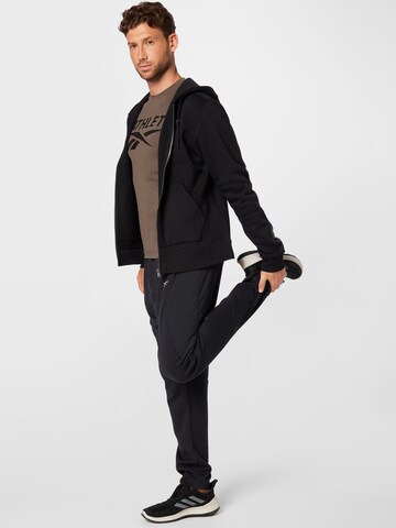 regular Pantaloni sportivi 'Road Trip' di Reebok in nero