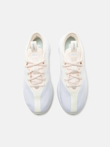 NIKE Urheilukengät 'Motiva 2' värissä valkoinen