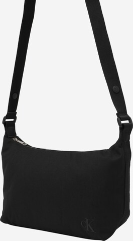 Sac à bandoulière Calvin Klein Jeans en noir : devant