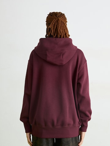 Nike Sportswear Collegetakki 'Phoenix Fleece' värissä punainen