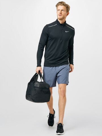 NIKE Regular Workout Pants 'Challenger' in Blue