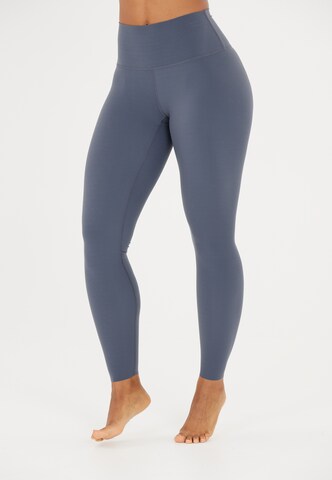 Athlecia Skinny Sportbroek 'Stay' in Blauw: voorkant