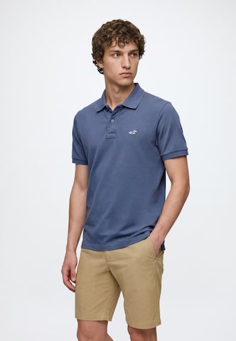 Tricou 'JUL4 INTL EXCLUSIVE' de la HOLLISTER pe albastru