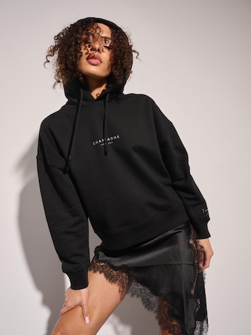 I want the moon Sweater 'Champagne Problems' in Black