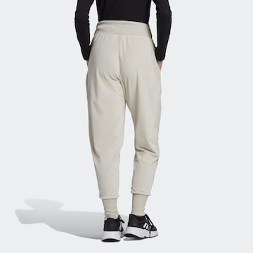 ADIDAS SPORTSWEAR Tapered Sportbroek 'Holidayz Cozy Velour' in Beige