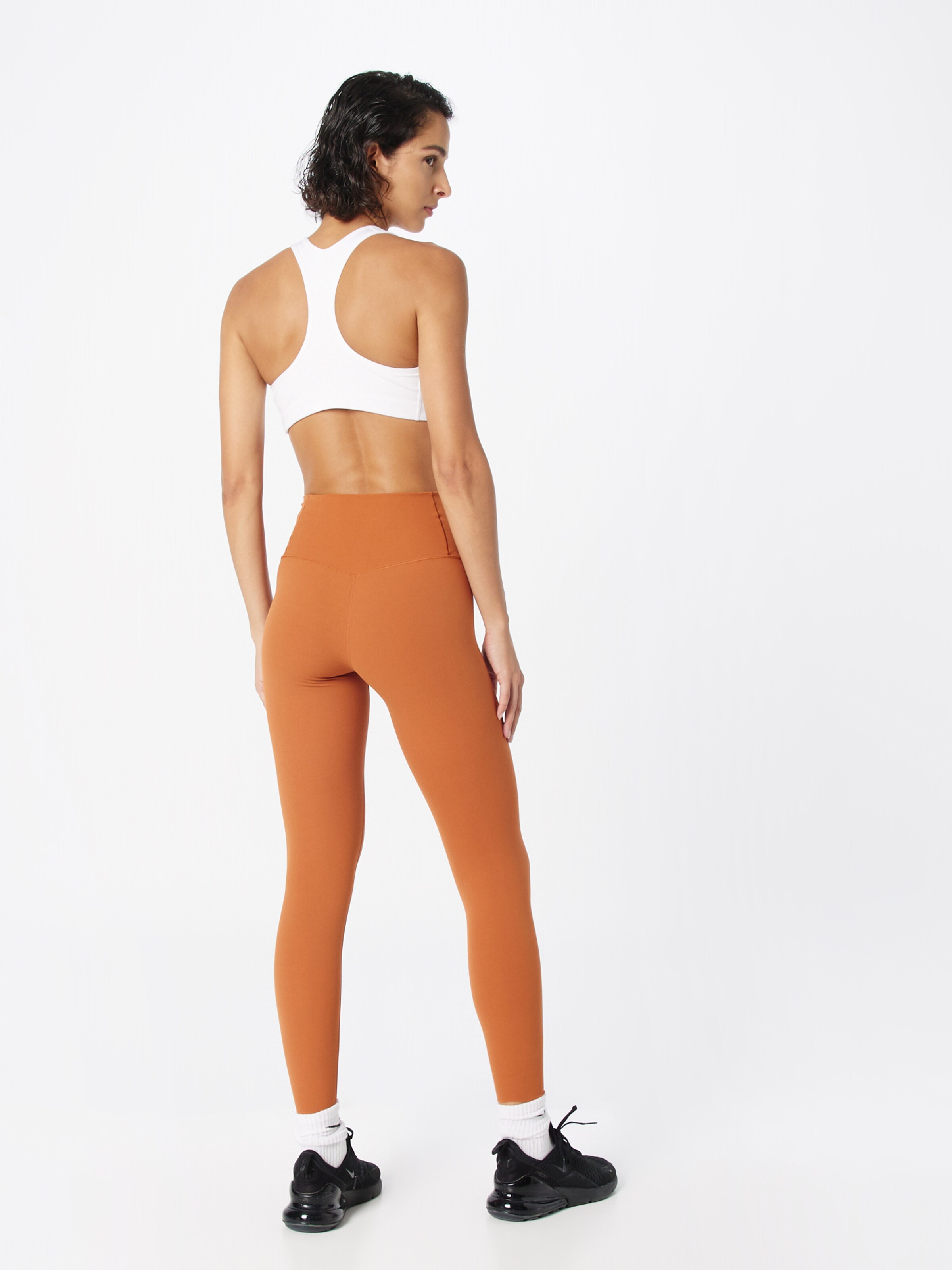 NIKE Skinny Workout Pants 'ZENVY' in Orange | ABOUT YOU