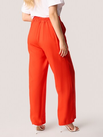Loosefit Pantaloni di Quiosque in arancione