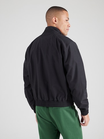 Nike Sportswear Övergångsjacka 'FUTURA' i svart