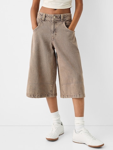 Bershka Wide leg Trousers in Beige: front