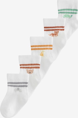 Next Sockor i vit: framsida